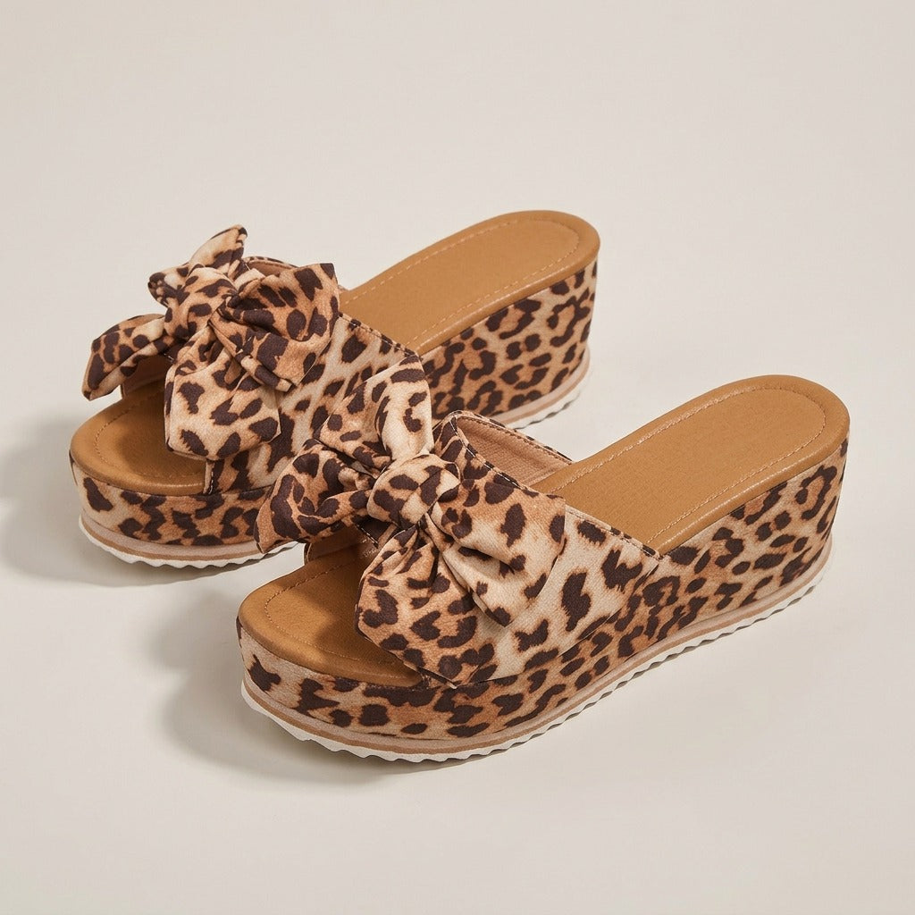 Leila leopard bow wedge slides, front view