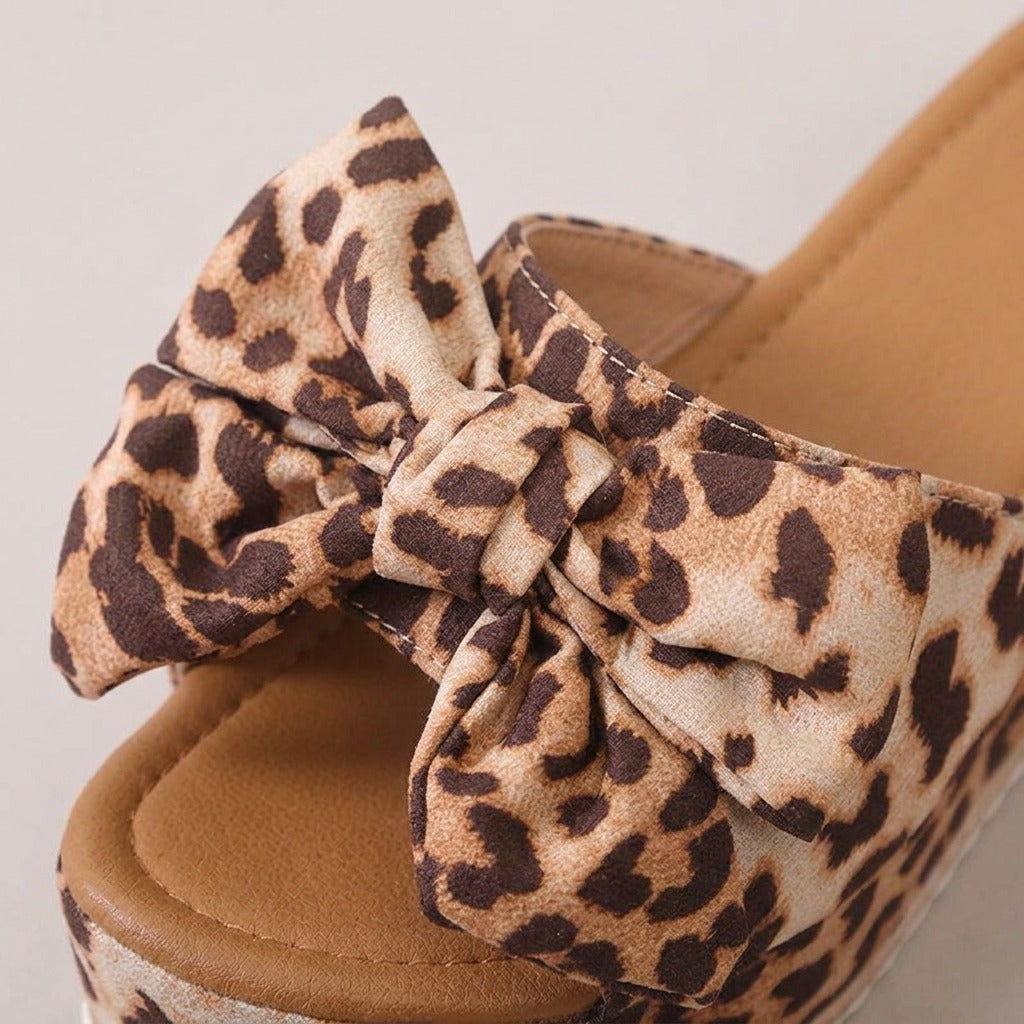 Leila leopard bow wedge slides, close-up of the material