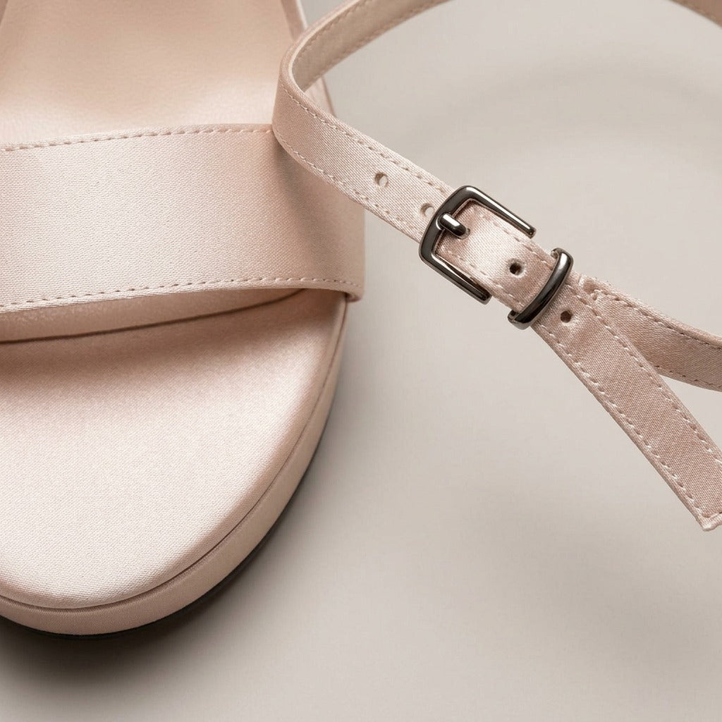 Margot champagne satin bow platform heels, close-up of the material