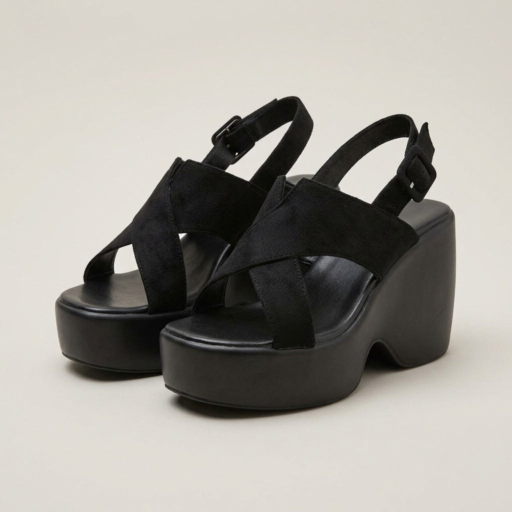 Sienna black cross-strap platform wedges, pair at a three-quarter angle