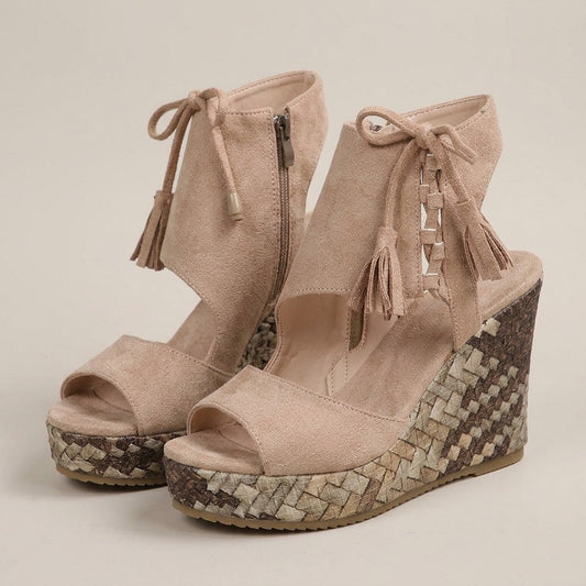 Tilly sand tassel lace-up espadrille wedges, pair at a three-quarter angle